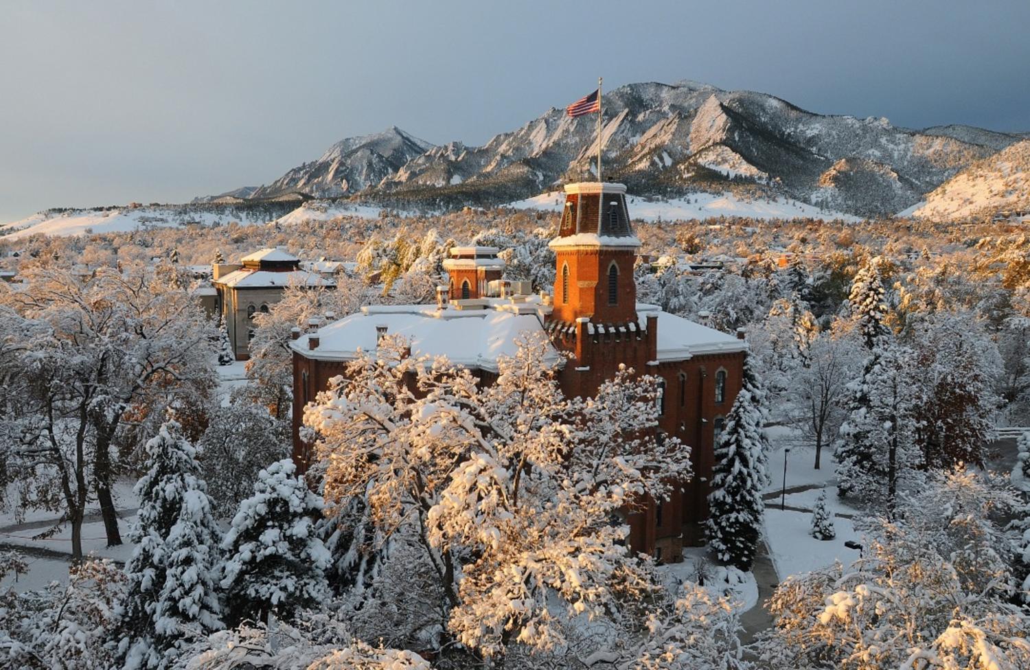 
          The majestic, snow-covered Flatirons is a breathtaking backdrop with Old Main at the University of Colorado Boulder in the foreground. (Photo by Casey A. Cass/University of Colorado)
        